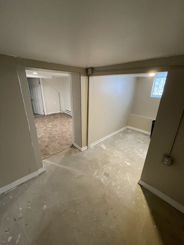 basement featuring baseboard heating