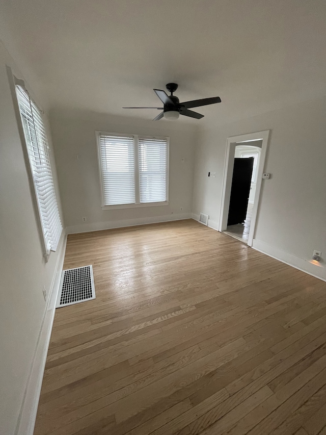 unfurnished room featuring ceiling fan and light hardwood / wood-style flooring