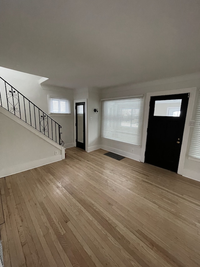 entryway with light hardwood / wood-style floors