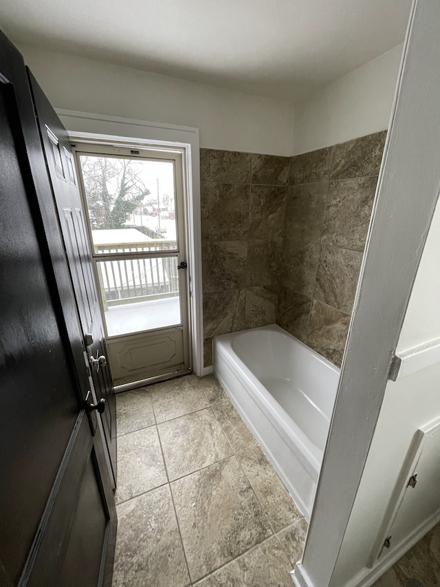 bathroom with a tub to relax in