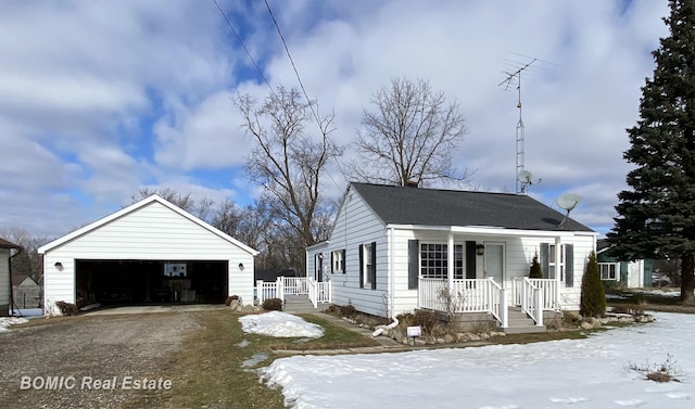 view of front of house featuring a garage and an outdoor structure