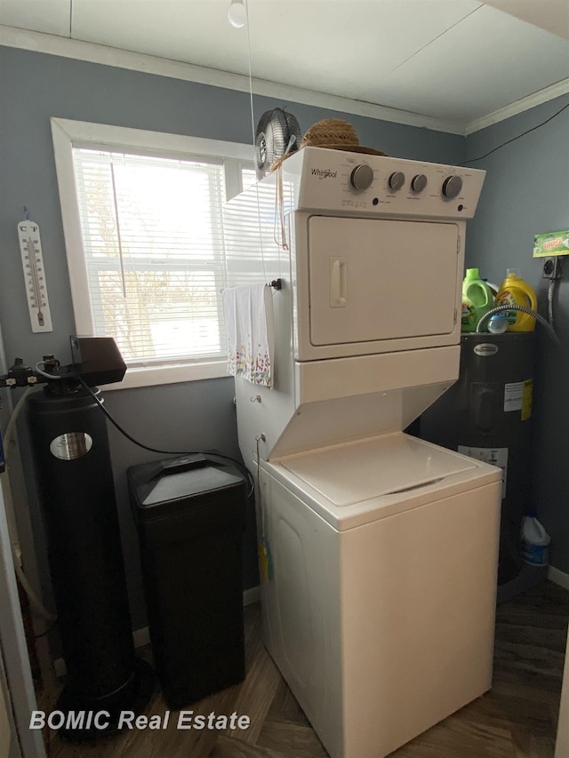 washroom with dark wood-type flooring and stacked washing maching and dryer