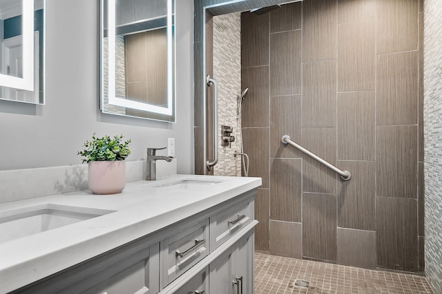 bathroom featuring vanity and a tile shower