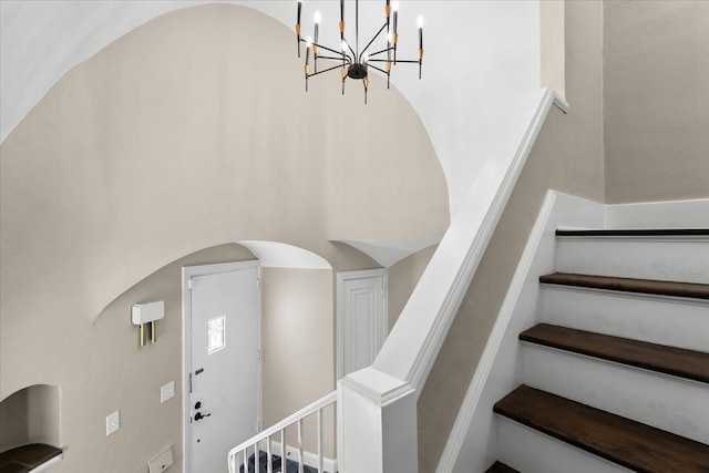 stairway featuring a high ceiling