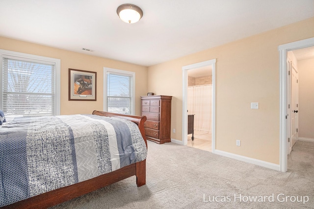 bedroom with light colored carpet