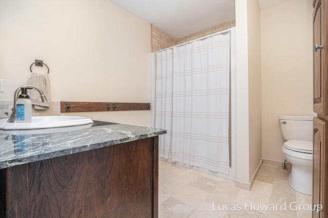 bathroom featuring vanity, a shower with curtain, and toilet