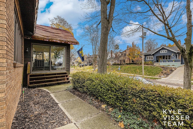 view of yard featuring entry steps