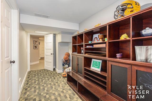 mudroom featuring baseboards and visible vents