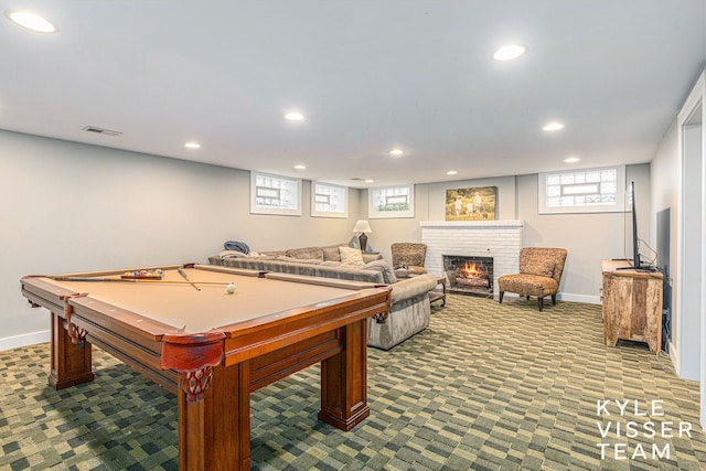 game room featuring plenty of natural light, a brick fireplace, visible vents, and recessed lighting