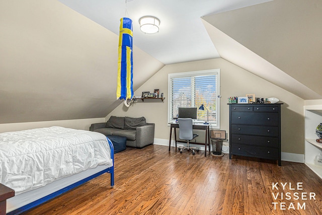 bedroom with vaulted ceiling, baseboards, and dark wood finished floors