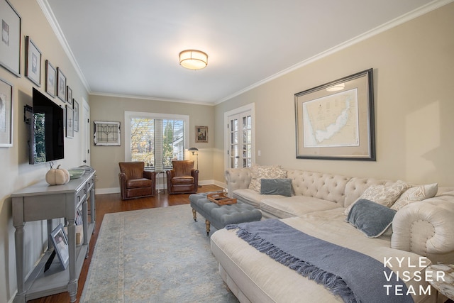 living room with ornamental molding, dark wood-style flooring, and baseboards