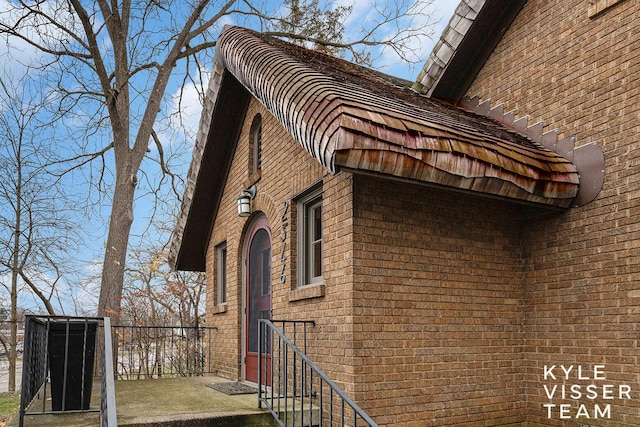 view of home's exterior featuring brick siding