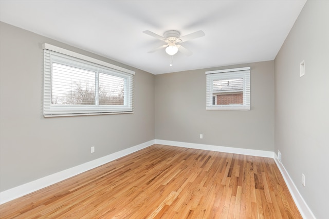 unfurnished room featuring ceiling fan and light wood-type flooring