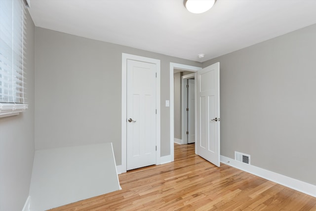 unfurnished bedroom featuring light hardwood / wood-style flooring