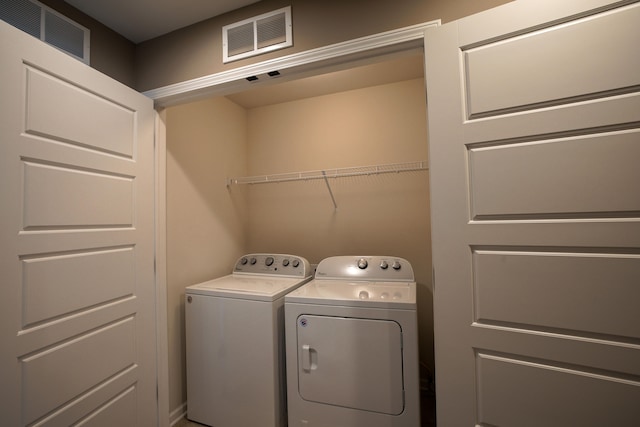 laundry area featuring washing machine and dryer