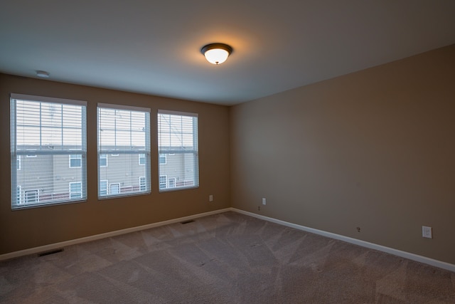 view of carpeted spare room