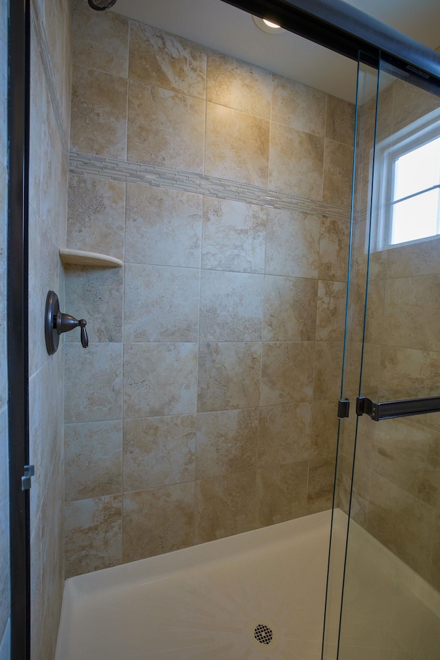 bathroom with an enclosed shower