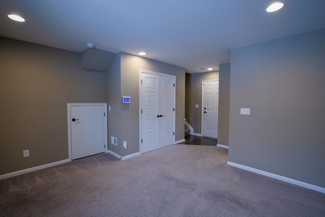 unfurnished room with carpet flooring