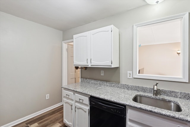 kitchen with white cabinetry, sink, light stone countertops, and black dishwasher