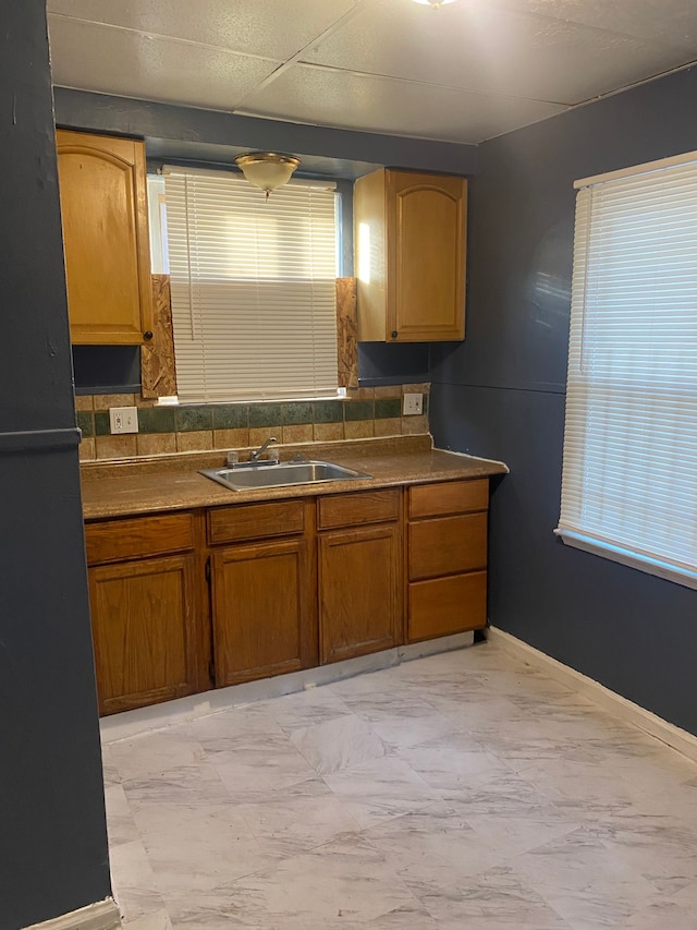 kitchen with black refrigerator and sink