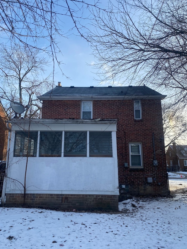 view of snow covered house