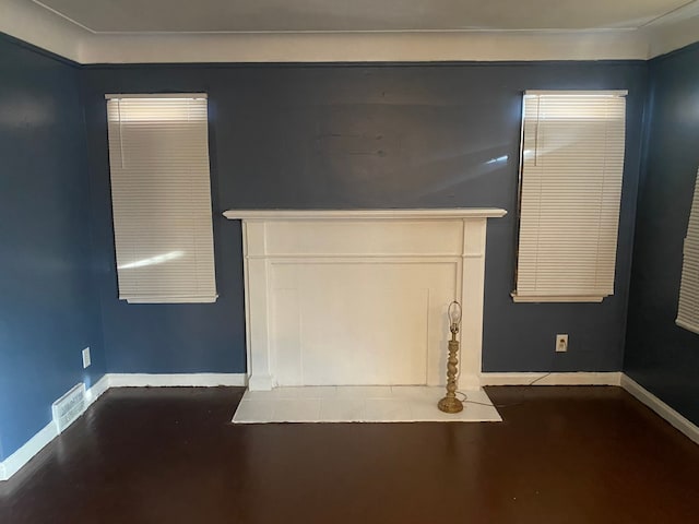 unfurnished living room with dark hardwood / wood-style flooring