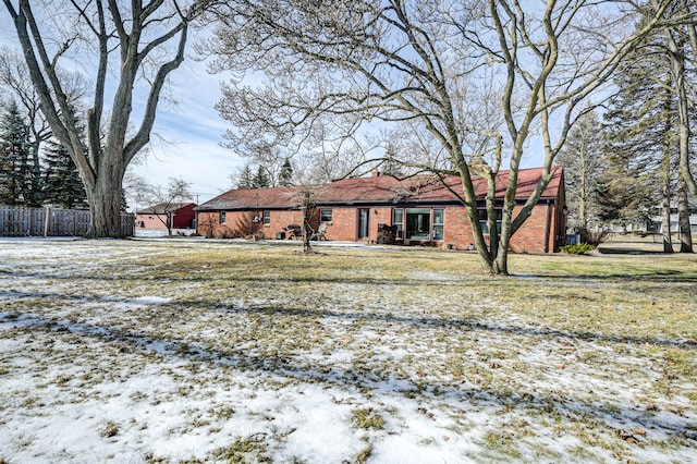 view of snow covered house