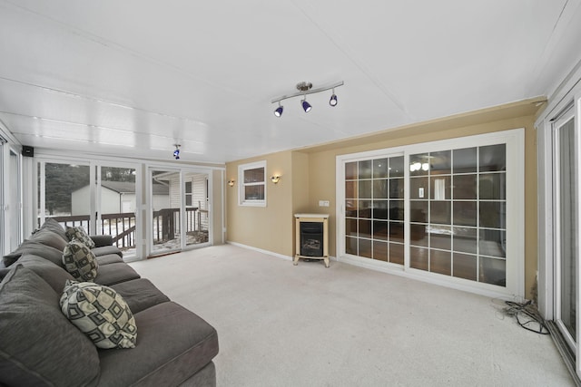 living room with track lighting and carpet