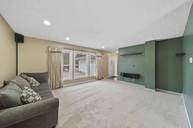 carpeted living room with a textured ceiling