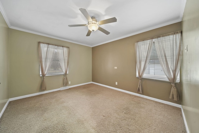 unfurnished room featuring crown molding, carpet floors, and ceiling fan