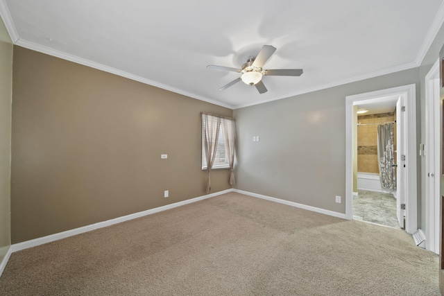 carpeted spare room with crown molding and ceiling fan