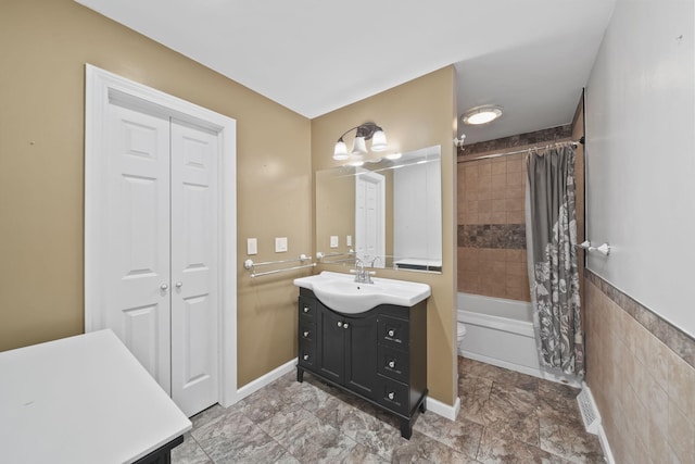 full bathroom featuring vanity, toilet, and shower / bath combo with shower curtain