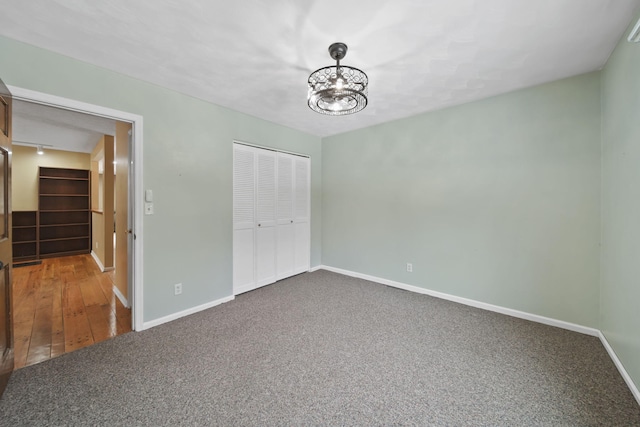 unfurnished bedroom with a closet and carpet