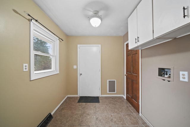 entryway with light tile patterned flooring