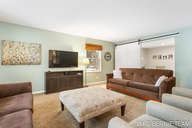 carpeted living room with a barn door