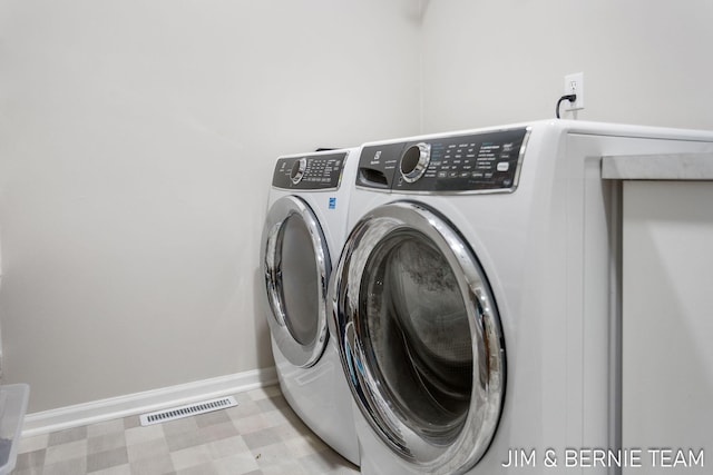 washroom with washer and clothes dryer