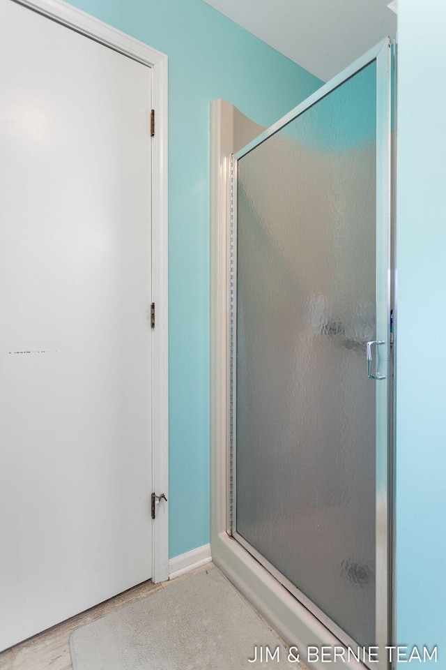 bathroom featuring an enclosed shower