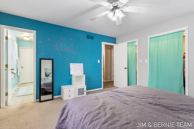 bedroom featuring light colored carpet and ceiling fan