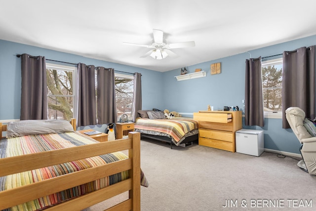 bedroom featuring ceiling fan and light colored carpet