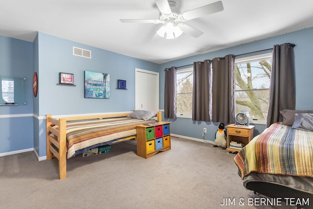 bedroom with a closet, ceiling fan, and carpet flooring