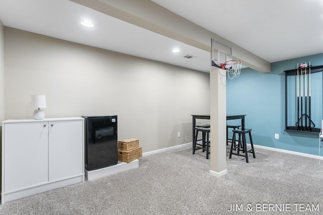 bar featuring white cabinets and carpet