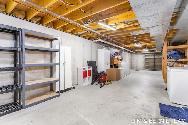 basement with washer and clothes dryer