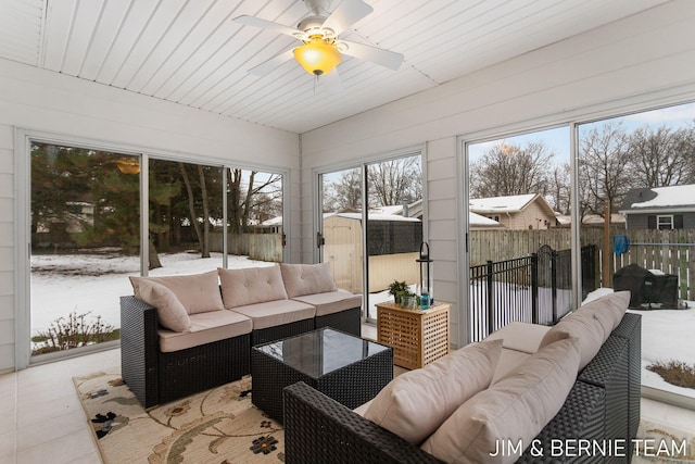 sunroom / solarium featuring ceiling fan and wooden ceiling