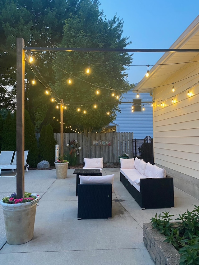 patio terrace at dusk featuring outdoor lounge area