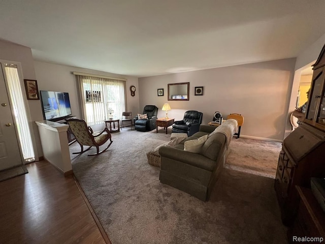 living room with dark wood-style floors and baseboards