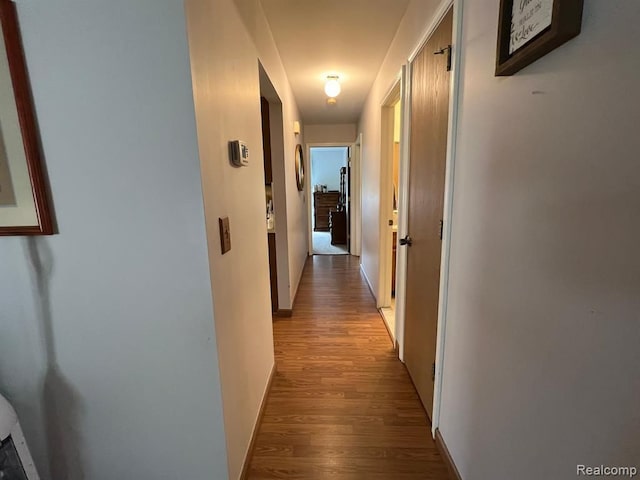 corridor with light wood-style flooring