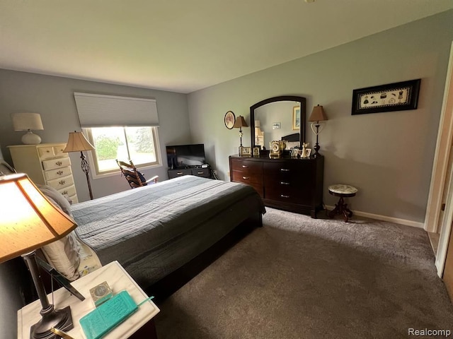 carpeted bedroom with baseboards