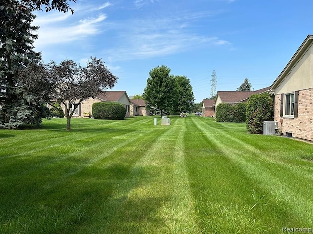 view of yard with central AC unit