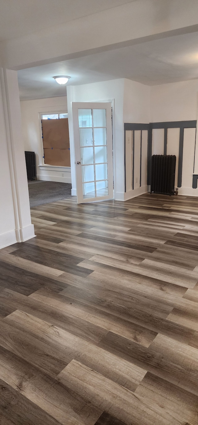 spare room featuring dark hardwood / wood-style floors