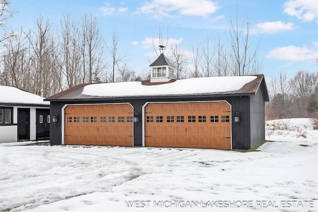 view of snow covered garage